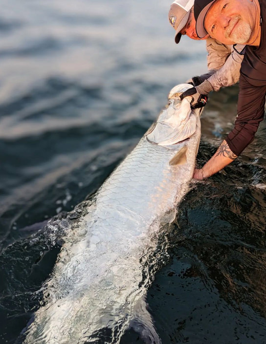 Capt Jesse posing with a large tarpon.